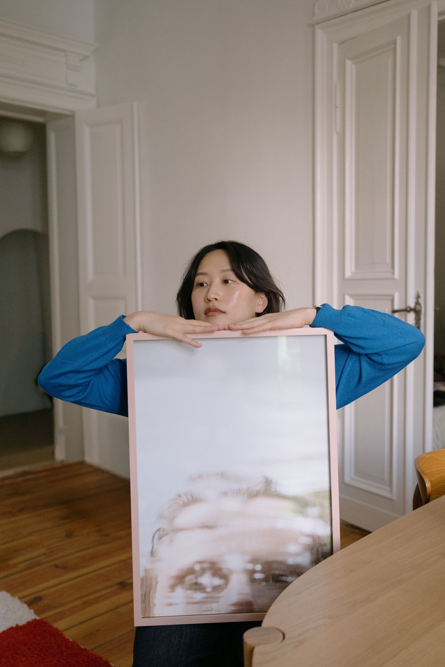 Image of a client with her custom made frame